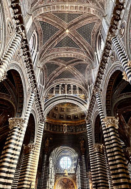 istock Stunning Interior of Siena Cathedral with Sun Rays Highlighting Gothic Architecture and Striped Columns 2237401223