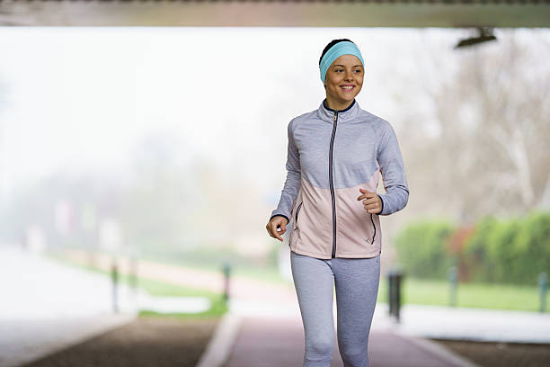 istock Young woman jogging outdoors, embracing a healthy, active lifestyle. 2237404935