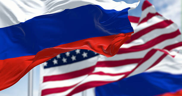 istock Russian and American flags waving side by side in wind. 3D render 2237410630
