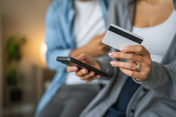 istock Couple using smart phone for online shopping and payment 2237412551