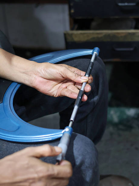 istock Close-up of a person's hands using a large Screw micrometer to measure a metal ring. 2237413111