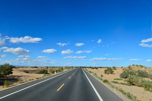 Desert road sand dunes in Xinjiang, China