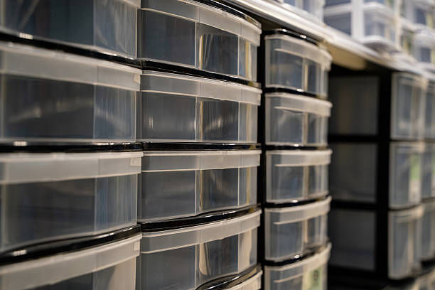 istock Plastic storage drawer organizers on shelf in hardware store. 2237424927