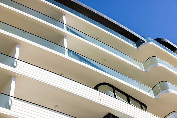 istock Closeup brand new modern apartment building in sunlight, background with copy space 2237427310