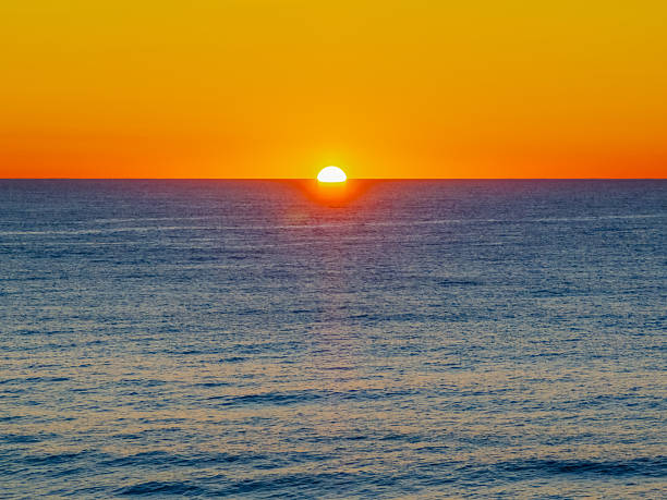 istock Sunrise at the seaside with a cloudless sky 2237428084