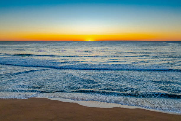 istock Sunrise at the seaside with a cloudless sky 2237428086