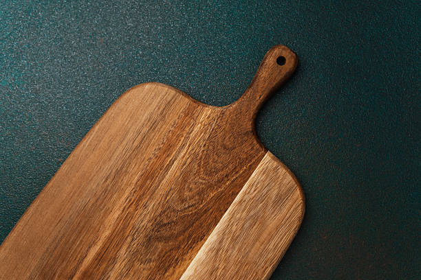 istock Unique wooden cutting board on dark background showcasing craftsmanship 2237429568