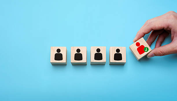 istock Human resources recruitment concept with hand selecting the best candidate from a lineup of people icons, symbolizing employee hiring, talent acquisition, and business staffing process 2237432680