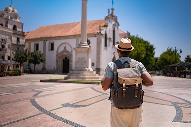 istock Back view of a backpacker in Bocage Square 2237434371