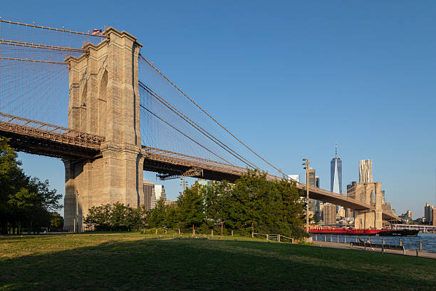 istock Brooklyn Bridge Tower with Manhattan Skyline at Sunrise 2237437560