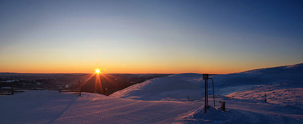 istock Sunrise Over Groomed Ski Slope in Trysil, Norway 2237437867