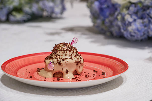 fine dining ice cream serving after main dish in dinner set of reception party