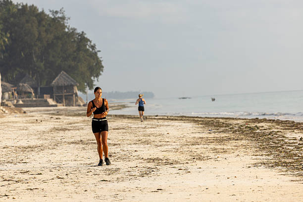 A woman running on the beach