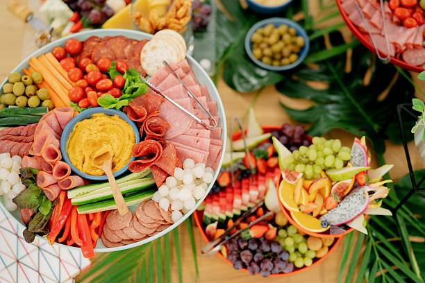 istock Gourmet Buffet Table with Cheese, Fruit, Cold Cuts, Dipping Sauce and Fresh Fruits 2237444782