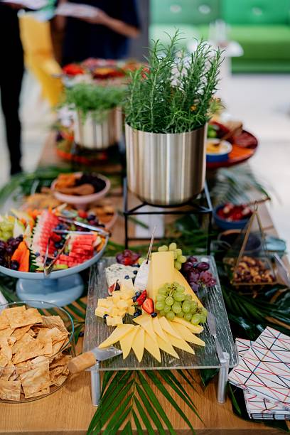 istock Gourmet Buffet Table with Cheese, Fruit, and Crackers on Wooden Table 2237444806