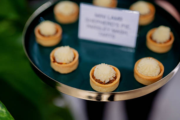 istock Mini Lamb Shepherd's Pie Appetizers Canape on Dark Turquoise and Gold Tray 2237444823