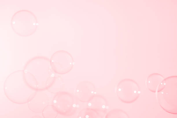 istock Beautiful Clear Pink Soap Bubbles Floating in The Air. Celebration Festive Backdrop. Freshness Soap Suds Bubbles Water. Pink and White Gradient Textured. 2237451898