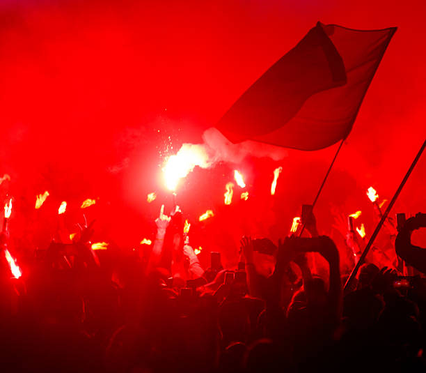 istock A crowd of people are gathered in a red and orange setting 2237459858