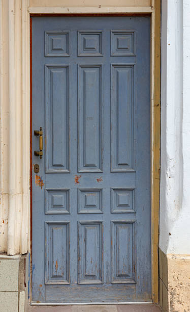 istock A blue door with a yellow trim 2237460397