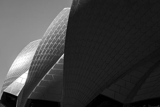 Sydney,NSW_ Jan 10,2024\nSydney Opera House Sails, late afternoon against dark sky.