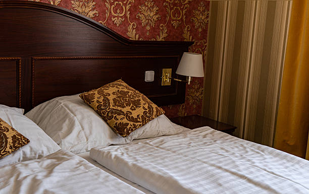istock Old styled bedroom with wooden bed 2237466917