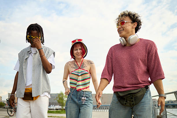 istock Multiethnic Young People Walking Outdoors and Smiling on Sunny Day 2237467420