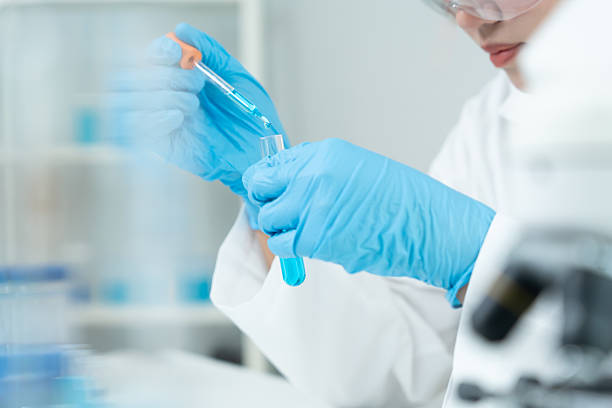 istock Scientist analyze biochemical samples in advanced scientific laboratory. Medical professional use dropper mix microbiological developmental of viral. Biotechnology research in  science lab. cosmetic 2237468817