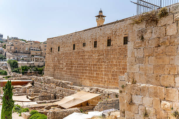 istock Temple Mount Wall with a minaret overlooking the archaeological site in Jerusalem. 2237469505