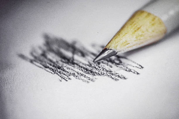 White sheet with pencil lines, eraser traces and writing tool arranged in neutral light for educational or creative themes