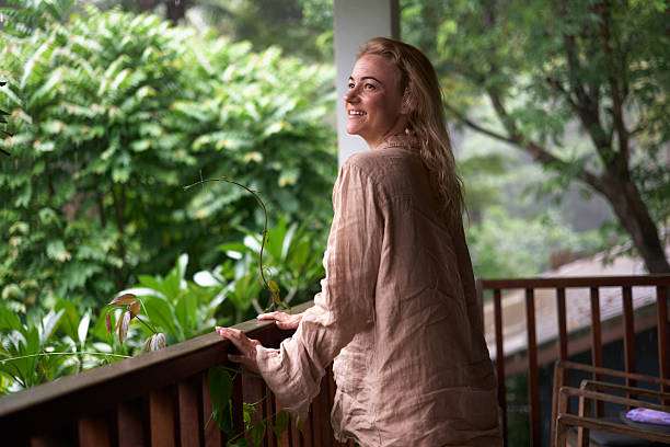 istock Happy woman day dreaming on a patio. 2237472287