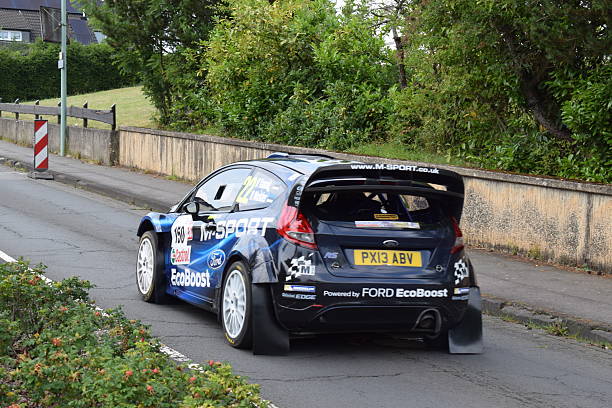 Daun, Germany - July 25/2025: Eifel Rally festival with vintage rally cars on public roads in the Eifel, Ford Fiesta WRC on a public road