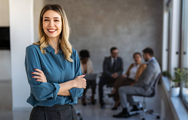 istock Successful executive standing proudly in office, representing business growth, partnership 2237474775