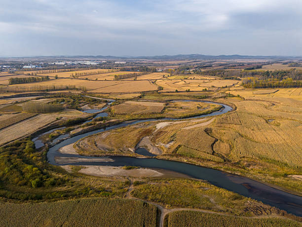 istock A Serpentine River Winding Through Autumn Fields in a Rural Landscape 2237474813