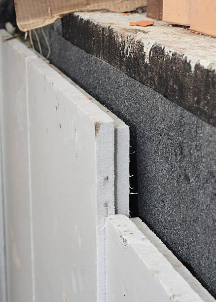 istock House foundation waterproofing and insulation with styrofoam boards. Close up on extruded polystyrene foam board panel styrofoam insulation panels on basement wall. 2237475880