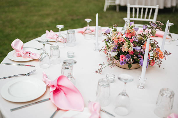 The hotel's banquet spoon arrangement is paired with flower vases to welcome important guests.