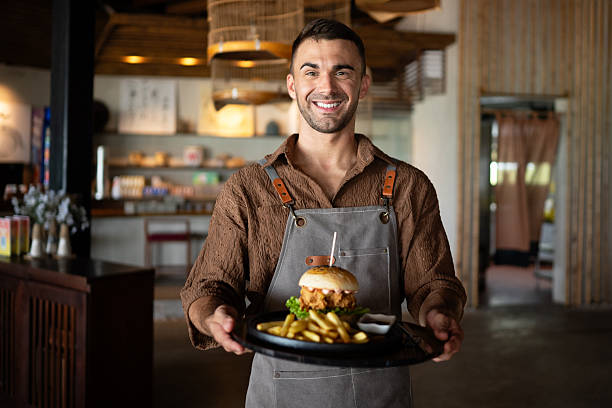 Restaurant marketing moment, a fresh burger and fries served with a smile creates visual content