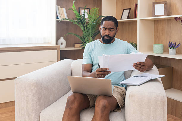 istock Young university student, freelancer business man, working at home on laptop computer, testing new innovative technology and online internet tools while sitting in home office. 2237480058