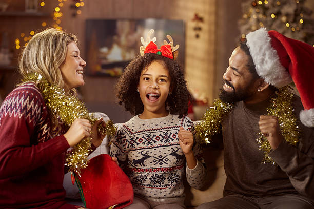 istock Happy diverse family dancing during Christmas at home. 2237481152