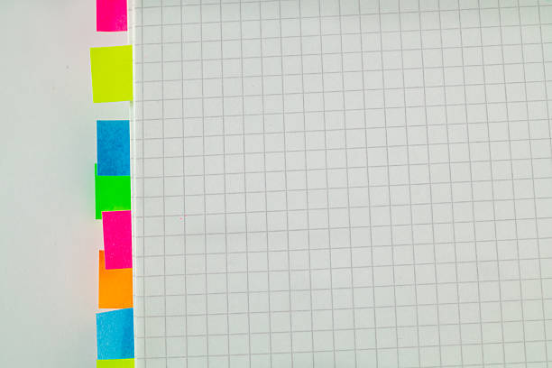 istock Open notebook with white blank paper with colored stickers on a white background. Copy space. 2237482353