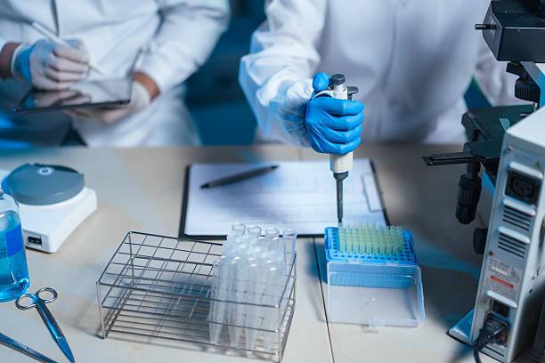 istock A lab technician pipettes samples into a microtube rack in veterinary andrology lab, recording semen analysis results to keep a sterile workflow and strict quality control for artificial insemination. 2237482611