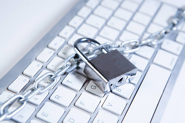 Cybersecurity and protection concept with pad lock and lap top
