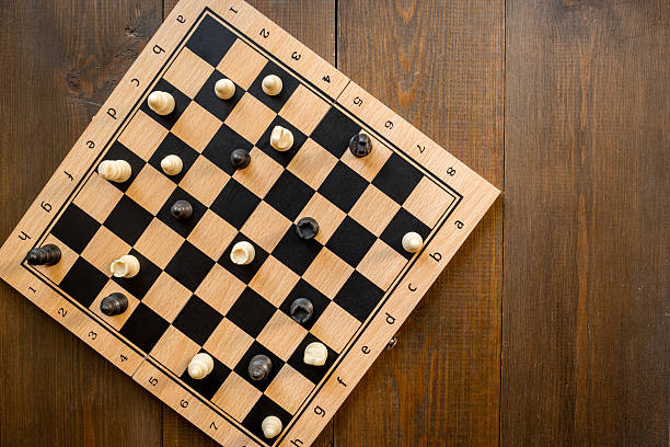 istock Top view of chess pieces and chessboard during the game 2237484335
