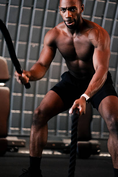 istock Muscular Man Training with Battle Ropes at Gym 2237486514