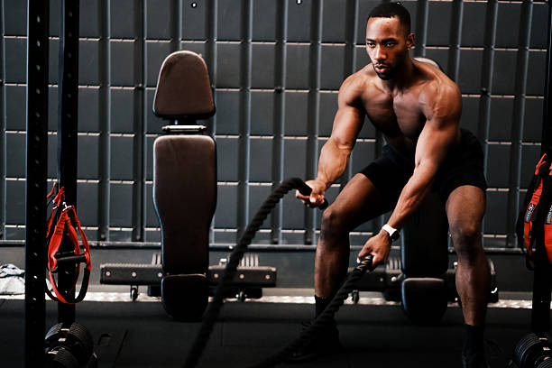 istock Muscular Man Training with Battle Ropes at Gym 2237486665