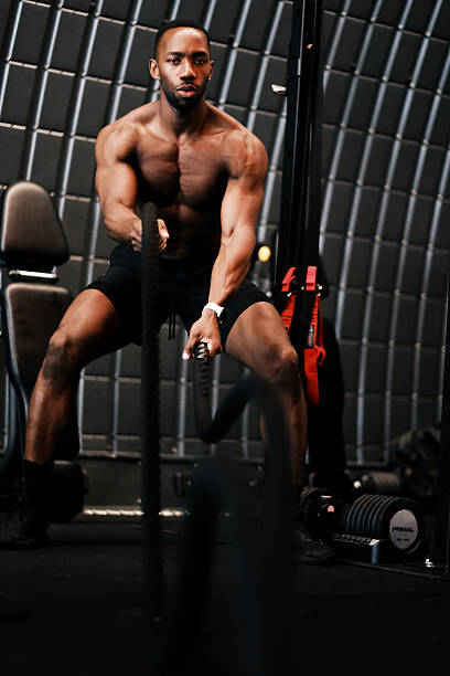 istock Muscular Man Training with Battle Ropes at Gym 2237486724