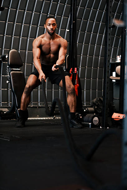 istock Muscular Man Training with Battle Ropes at Gym 2237486772