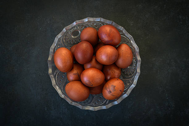istock Dyed Easter Eggs in a Glass Bowl on Dark Background 2237487778