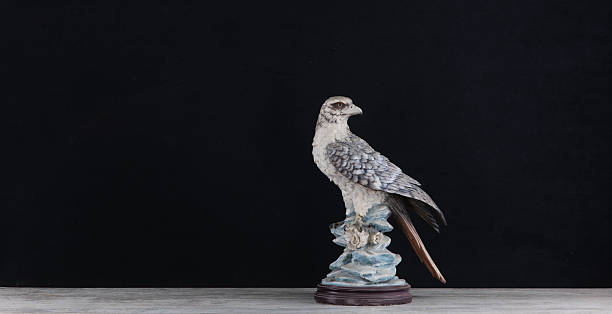 decorative statue of  bird of prey on table