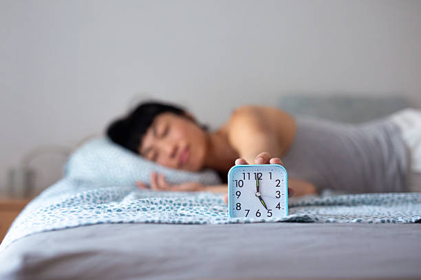 mid adult man sleeping on the bed selective focus image