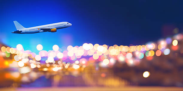 istock Jet airliner in flight over city. 2237489707